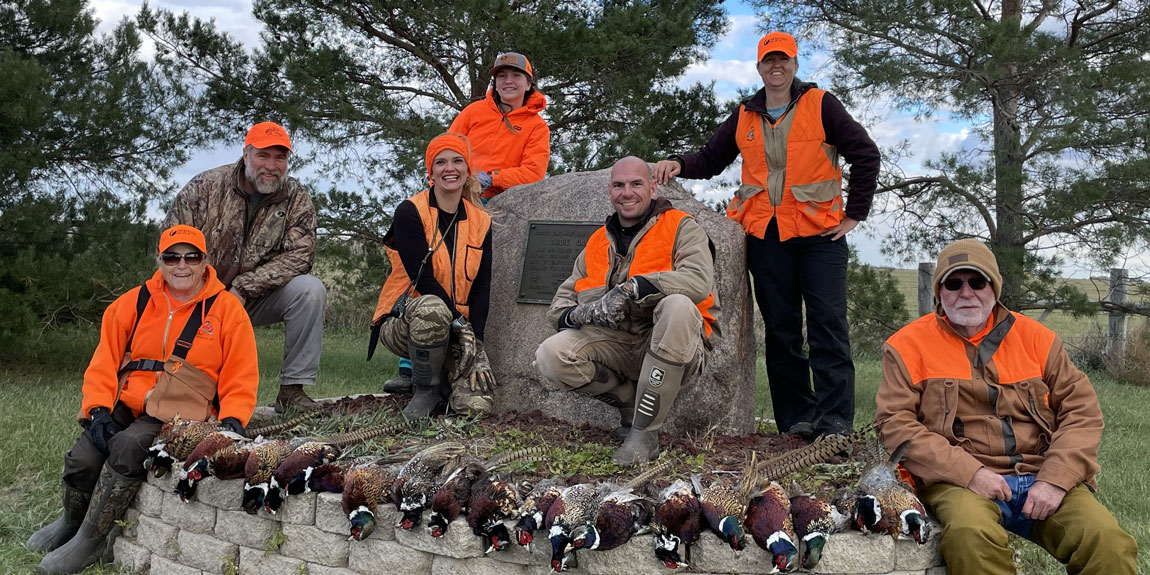 happy hunters with their limit of pheasants